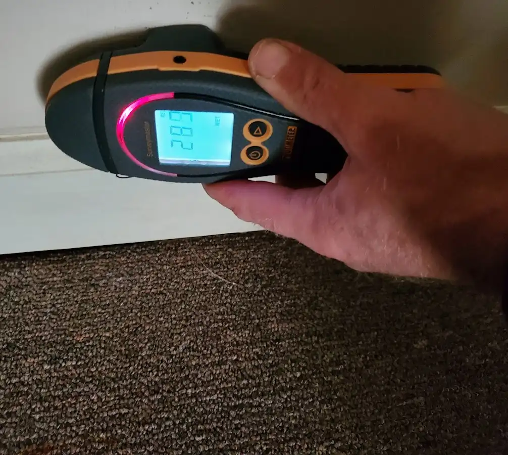 Moisture detection at baseboard during Storm Damage Restoration in Opelousas